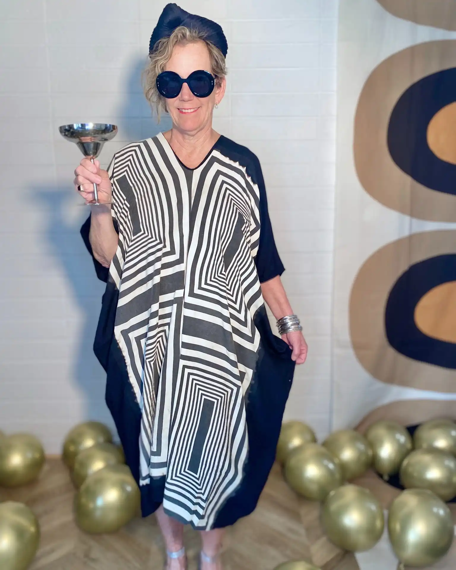 Give us a twirl! 💃 

The latest and greatest - The Kakee Midi Kaftan in Mod Squad print. We love it for its bold graphics ease of wear. Perfect kaftan for kicking those shoes off and doing a little happy dance! 😃 

#DrinkingDress #DrinkingDresses #Kaftan #CocktailKaftan #PartyDress